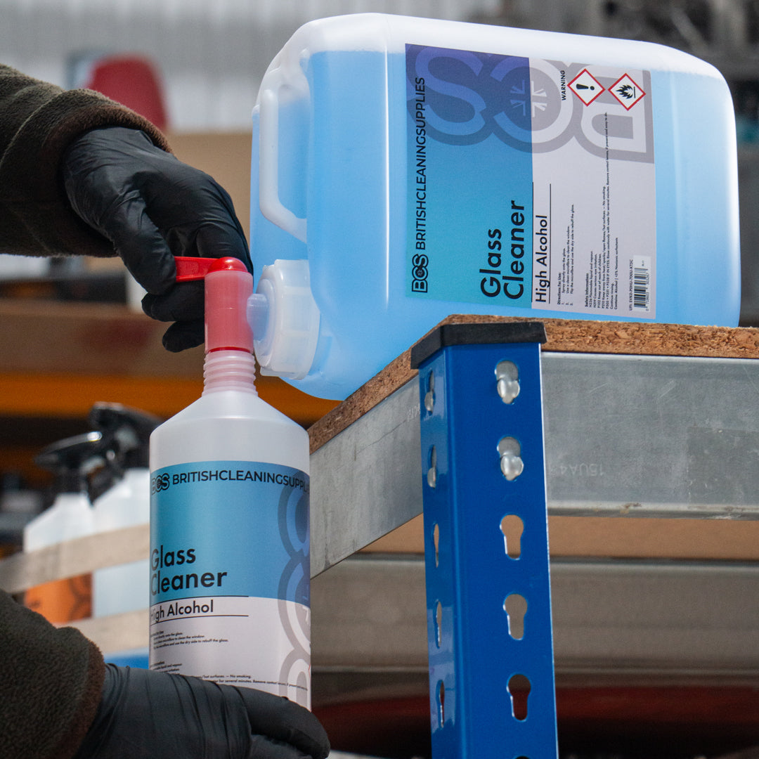 BCS Glass cleaner being decanted into a smaller bottle for use.