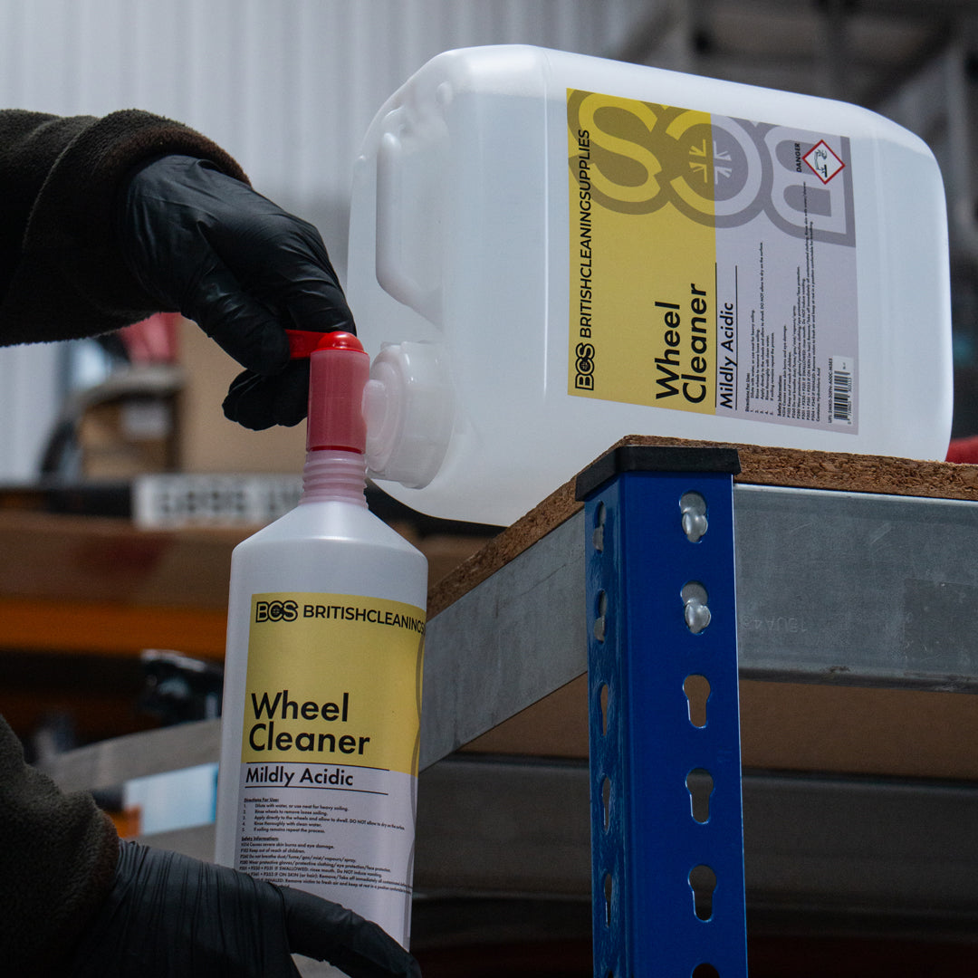 Person decanting a 5 Litre wheel cleaner into a 1 litre bottle