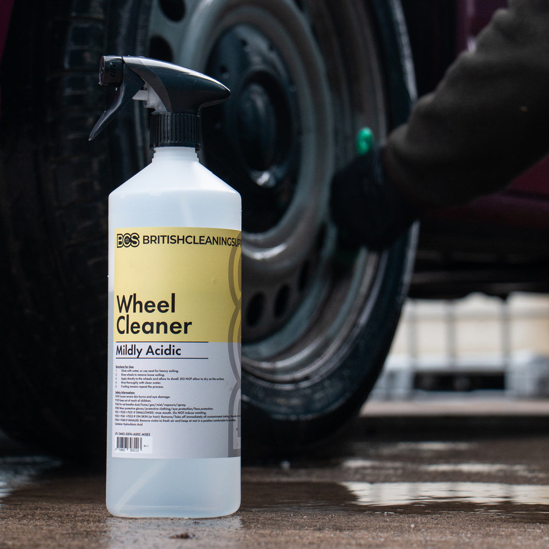 Bottle of British Cleaning Supplies Wheel Cleaner with a car wheel being cleaned in the background