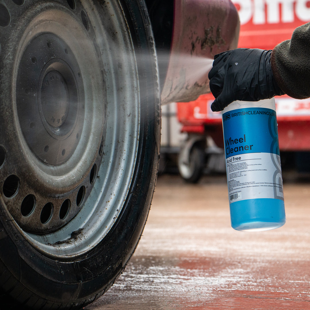 Person spraying BCS wheel cleaner on to a dirty steel wheel.