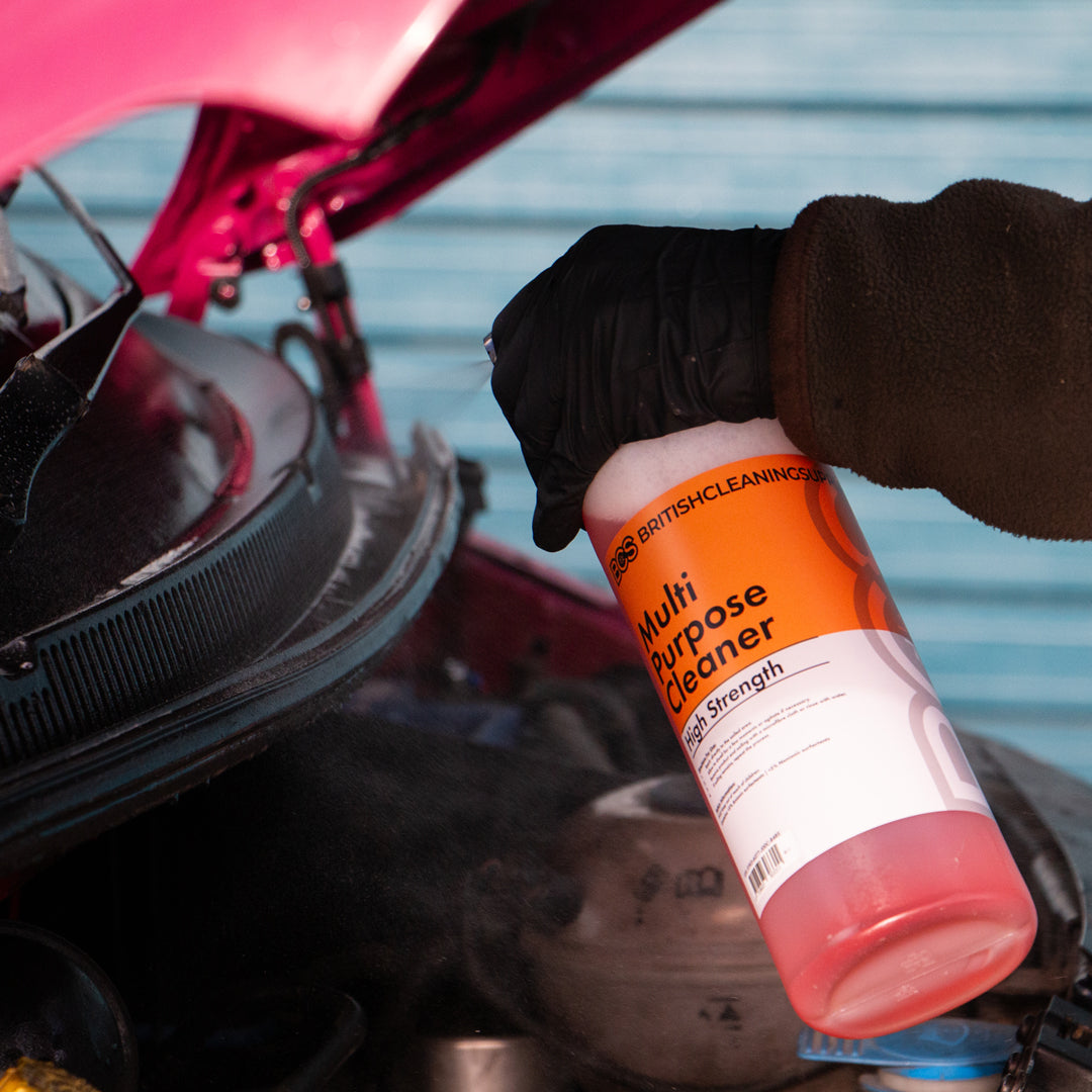 Person spraying Multi Purpose Cleaner on to vehicle scuttle tray