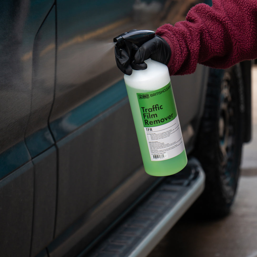 BCS Traffic Film Remover being sprayed onto a dirty vehicle.