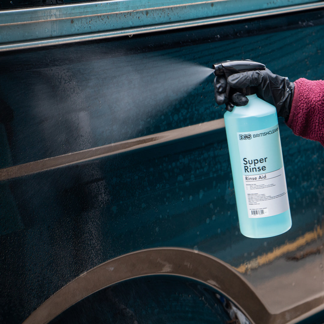 Person spraying BCS Super rinse directly onto a van