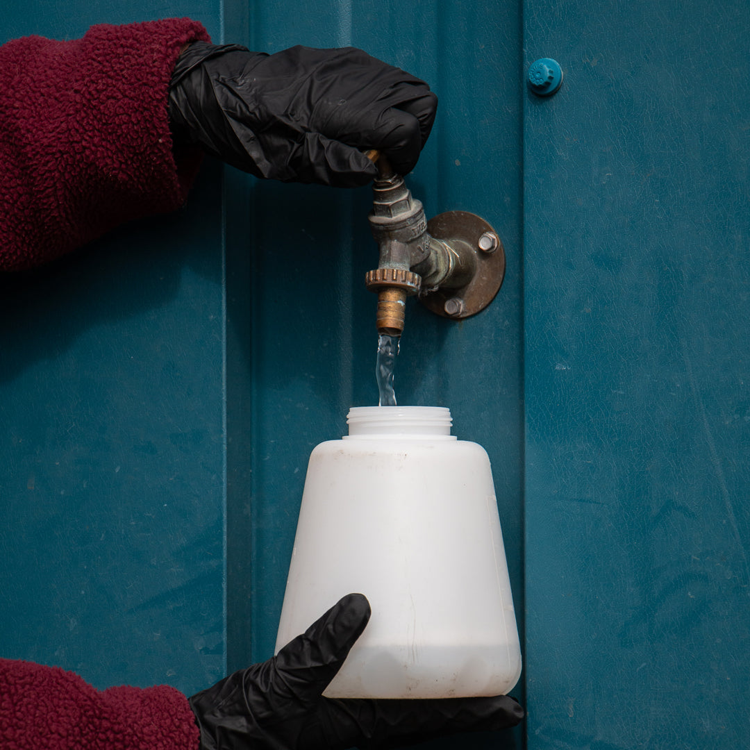 BCS Rinse wax being diluted with water for use.